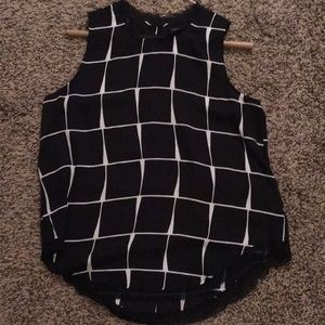 Black and white sleeveless blouse